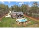 Lovely home with fenced yard featuring a nice in-ground pool, deck, and mature trees that provide privacy and shade at 1770 Cranwell Dr, Mt Ulla, NC 28125