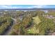 Breathtaking aerial shot capturing the golf course, mature trees, and homes of the neighborhood at 17733 Colleton River Ln, Charlotte, NC 28278