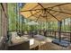 Spacious back deck with comfortable seating and dining area, perfect for relaxing in the shade at 17733 Colleton River Ln, Charlotte, NC 28278