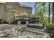 Inviting backyard patio featuring a hot tub and a raised deck with outdoor seating for entertaining at 17733 Colleton River Ln, Charlotte, NC 28278