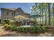 Brick home featuring an expansive patio with plenty of seating at 17733 Colleton River Ln, Charlotte, NC 28278