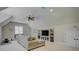 Bright bonus room with vaulted ceilings, ceiling fan, and entertainment center at 17733 Colleton River Ln, Charlotte, NC 28278