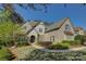 Charming brick home features a manicured lawn, walkway, and tasteful landscaping at 17733 Colleton River Ln, Charlotte, NC 28278