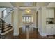 Spacious foyer with hardwood floors, staircase, and views of the living room at 17733 Colleton River Ln, Charlotte, NC 28278