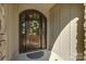 Elegant wood front door with glass and wreath for a warm and inviting entrance at 17733 Colleton River Ln, Charlotte, NC 28278