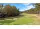 Scenic golf course view with lush green fairway and sand traps, perfect for golf enthusiasts at 17733 Colleton River Ln, Charlotte, NC 28278