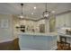 Beautiful kitchen with white cabinets, granite countertops, and modern stainless steel appliances at 17733 Colleton River Ln, Charlotte, NC 28278
