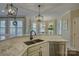 Open concept kitchen with granite counters, stainless appliances, breakfast area, and natural light at 17733 Colleton River Ln, Charlotte, NC 28278