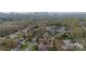 Picturesque aerial view of a residential neighborhood, lush trees and city skyline at 1801 Maryland Ave, Charlotte, NC 28209