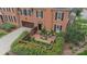 Aerial view of a brick patio with seating, surrounded by lush greenery and a manicured lawn at 1801 Maryland Ave, Charlotte, NC 28209