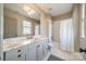 Bright bathroom with a marble countertop vanity, stylish fixtures, and a tub-shower combination at 1801 Maryland Ave, Charlotte, NC 28209