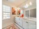 Bright bathroom with double vanity, stylish fixtures, and large mirror at 1801 Maryland Ave, Charlotte, NC 28209