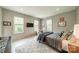Comfortable bedroom with neutral tones, plush rug, and natural light at 1801 Maryland Ave, Charlotte, NC 28209