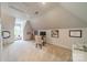 Bright bonus room featuring a work station with a view, vaulted ceiling and cozy carpet at 1801 Maryland Ave, Charlotte, NC 28209