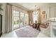 Bright breakfast nook with French doors to backyard and a crystal chandelier at 1801 Maryland Ave, Charlotte, NC 28209