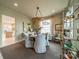 Bright dining area with a round table, chandelier, neutral colors, and ample natural light at 1801 Maryland Ave, Charlotte, NC 28209