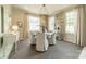 Cozy dining room with decorative chandelier, neutral walls, and natural light at 1801 Maryland Ave, Charlotte, NC 28209