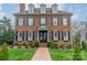 Classic brick facade with dormer windows and black shutters, framed by a well-kept green lawn at 1801 Maryland Ave, Charlotte, NC 28209