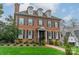 Beautiful brick home with a manicured lawn, black shutters, and a charming entrance at 1801 Maryland Ave, Charlotte, NC 28209