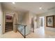 Upstairs hallway featuring white trim, hardwood floors, and doorways to other rooms at 1801 Maryland Ave, Charlotte, NC 28209