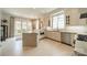 Modern kitchen featuring an island, white cabinetry, and stainless steel appliances at 1801 Maryland Ave, Charlotte, NC 28209