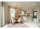 Sunny breakfast nook features a chandelier, bench seating, and adjoins modern kitchen at 1801 Maryland Ave, Charlotte, NC 28209