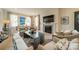 Comfortable living room with neutral furniture, a fireplace, and abundant natural light at 1801 Maryland Ave, Charlotte, NC 28209