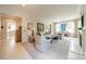 Open living room with comfortable seating, art, and fireplace at 1801 Maryland Ave, Charlotte, NC 28209