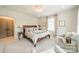 Serene main bedroom suite with crystal chandelier and natural light at 1801 Maryland Ave, Charlotte, NC 28209
