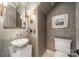 Stylish powder room features patterned wallpaper, a modern sink, decorative mirror, and toilet at 1801 Maryland Ave, Charlotte, NC 28209