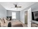 Spacious bedroom featuring a ceiling fan, desk, neutral walls and beige carpet at 1812 Rosewell Dr, Rock Hill, SC 29732