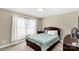 Bedroom with a queen size bed, nightstand, dark wood furniture and neutral walls at 1812 Rosewell Dr, Rock Hill, SC 29732