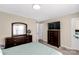 Bedroom featuring a large mirror, dresser, a wall-mounted television and ceiling fan at 1812 Rosewell Dr, Rock Hill, SC 29732