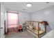 Bright bedroom featuring a unique wooden bed frame and neutral walls at 1812 Rosewell Dr, Rock Hill, SC 29732