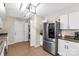 Modern kitchen featuring stainless steel appliances and convenient access to the laundry area at 1812 Rosewell Dr, Rock Hill, SC 29732