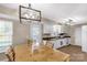 Bright kitchen and dining area with modern lighting and tile flooring at 1812 Rosewell Dr, Rock Hill, SC 29732