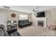Inviting living room with fireplace, TV, and neutral decor at 1812 Rosewell Dr, Rock Hill, SC 29732