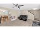 Cozy living room featuring a ceiling fan, recliner sofa, and an open view to the kitchen at 1812 Rosewell Dr, Rock Hill, SC 29732