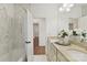Bathroom features dual sinks, marble and updated fixtures at 18512 Square Sail Rd, Cornelius, NC 28031
