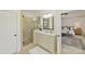Elegant bathroom with a glass-enclosed shower and a large vanity with double sinks at 18512 Square Sail Rd, Cornelius, NC 28031