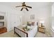 Cozy bedroom featuring neutral decor, wood-framed bed, and ensuite bathroom at 18512 Square Sail Rd, Cornelius, NC 28031