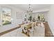 Light and bright dining room leads into a sitting room area, offering open sightlines at 18512 Square Sail Rd, Cornelius, NC 28031