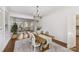 Light and bright dining room leads into a sitting room area, offering open sightlines at 18512 Square Sail Rd, Cornelius, NC 28031