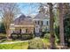 Stunning stone exterior with well-manicured landscaping, and a charming entrance, creating an inviting curb appeal at 18512 Square Sail Rd, Cornelius, NC 28031