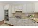 Charming kitchen featuring granite countertops, stainless steel appliances, and custom cabinetry at 18512 Square Sail Rd, Cornelius, NC 28031
