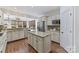 Bright kitchen with granite countertops, stainless steel appliances, and island at 18512 Square Sail Rd, Cornelius, NC 28031
