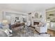 Inviting living room with fireplace, built-ins, and neutral decor at 18512 Square Sail Rd, Cornelius, NC 28031