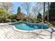 Gorgeous backyard pool with surrounding patio perfect for relaxation and outdoor entertainment at 18512 Square Sail Rd, Cornelius, NC 28031