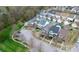 Discover this neighborhood from above with manicured lawns, tree-lined streets, and various home styles at 18710 Coverdale Ct, Cornelius, NC 28031