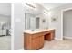 Bathroom with double sink vanity and warm lighting at 18710 Coverdale Ct, Cornelius, NC 28031